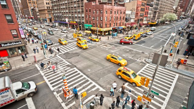 NEW YORK - MARCH 21: City streetlife in point of intersection