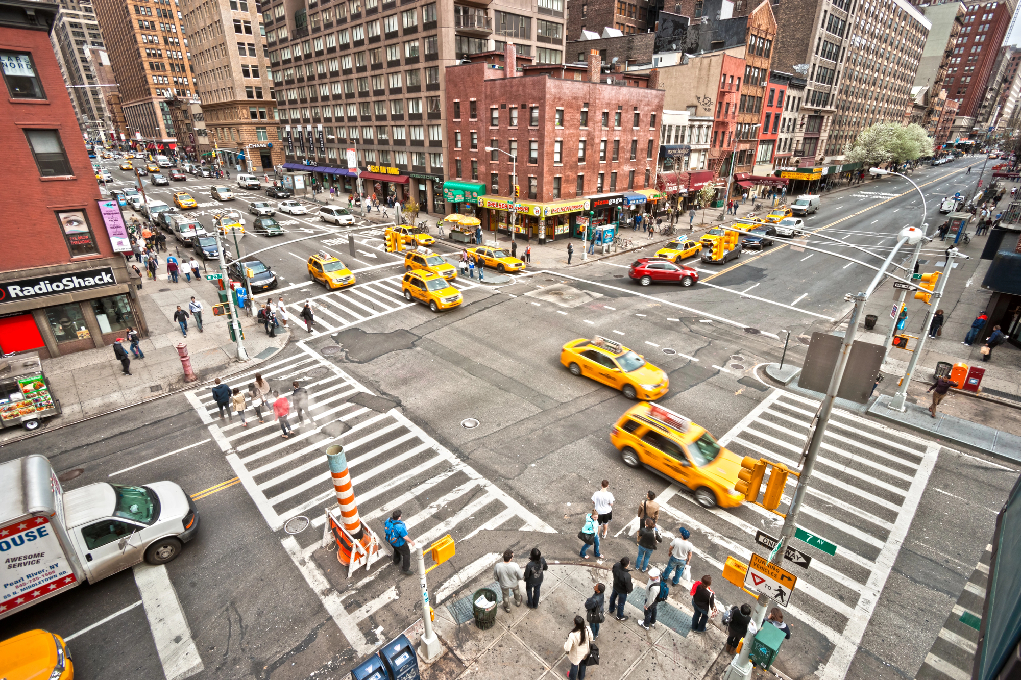 NEW YORK - MARCH 21: City streetlife in point of intersection