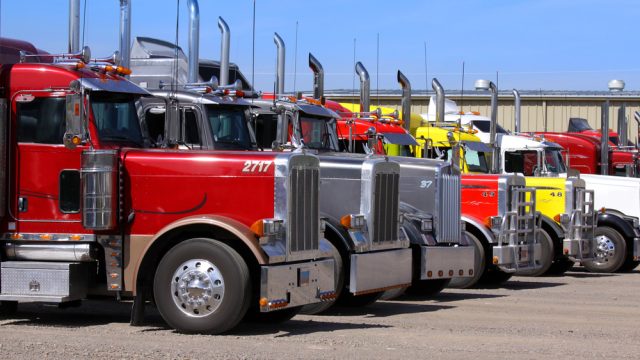 Panguitch,Utah - July 20: Row of Semi trailer trucks July 20, 2009 in Panguitch,Utah, There are about 5.6 million semi trailers (or tractor trailers) registered for use in the U.S., almost three times the number of semi trucks. — Photo by snehitdesign