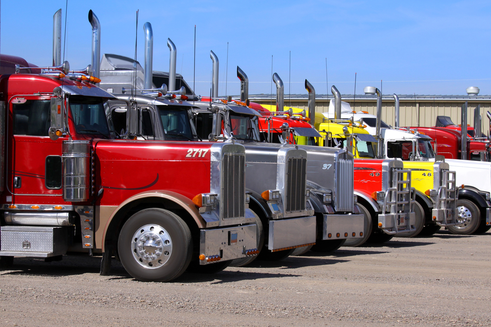 Panguitch,Utah - July 20: Row of Semi trailer trucks July 20, 2009 in Panguitch,Utah, There are about 5.6 million semi trailers (or tractor trailers) registered for use in the U.S., almost three times the number of semi trucks. — Photo by snehitdesign