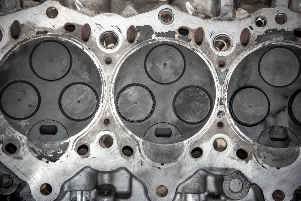 Head removed from the engine with visible three valves
