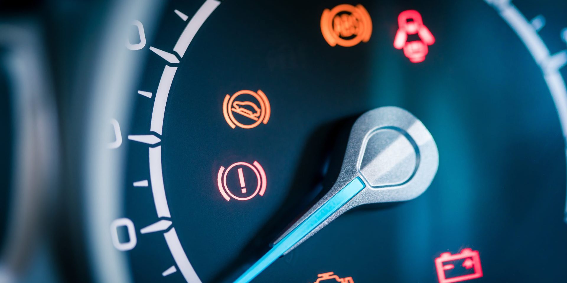 Many different car dashboard lights with warning lamps illuminated.