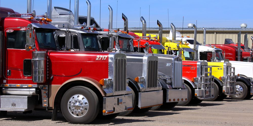 Panguitch,Utah - July 20: Row of Semi trailer trucks July 20, 2009 in Panguitch,Utah, There are about 5.6 million semi trailers (or tractor trailers) registered for use in the U.S., almost three times the number of semi trucks. — Photo by snehitdesign Panguitch,Utah - July 20: Row of Semi trailer trucks July 20, 2009 in Panguitch,Utah, There are about 5.6 million semi trailers (or tractor trailers) registered for use in the U.S., almost three times the number of semi trucks. — Photo by snehitdesign