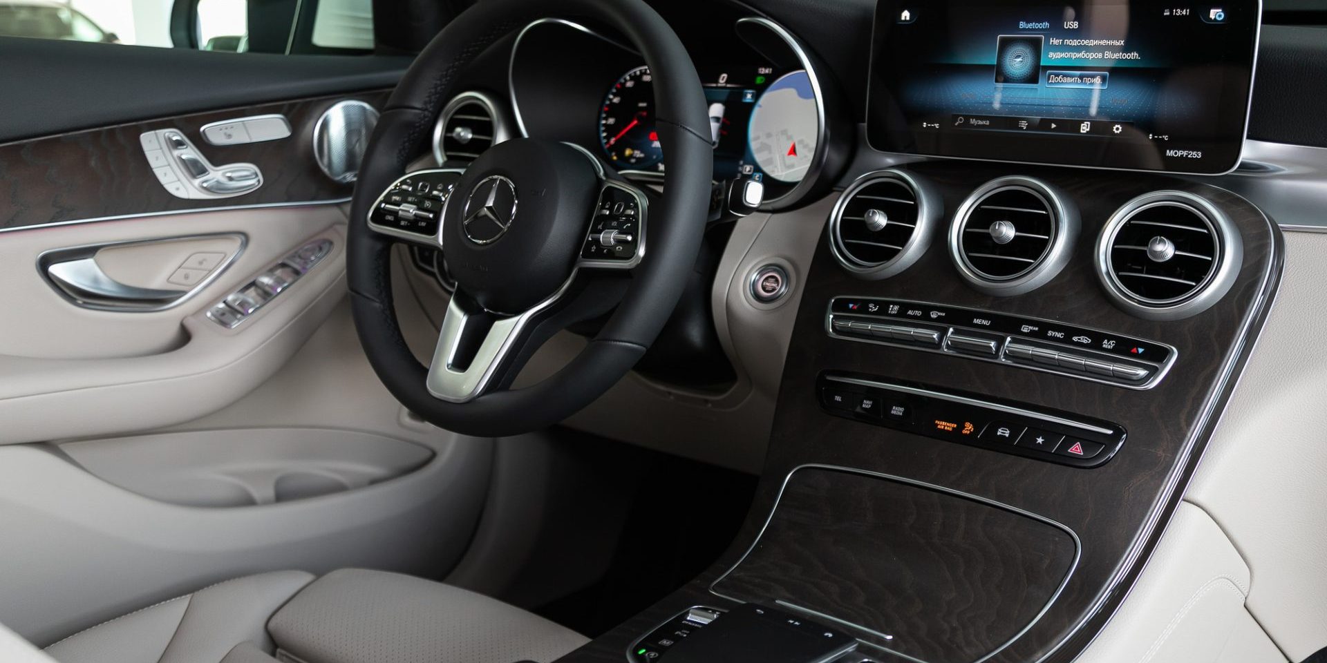 Mercedes-Benz GLC-class,close-up of the dashboard, player, steering wheel, accelerator handle, buttons, seats. modern car interior: parts, buttons, knob — Photo by everyonensk