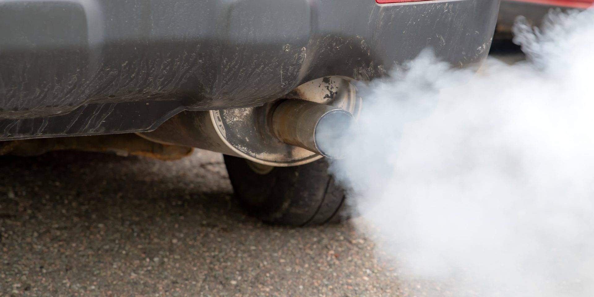 Car Exhaust Smoke Closeup Thick smoke pours from the exhaust pile on a car (image courtesy Deposit Photos)
