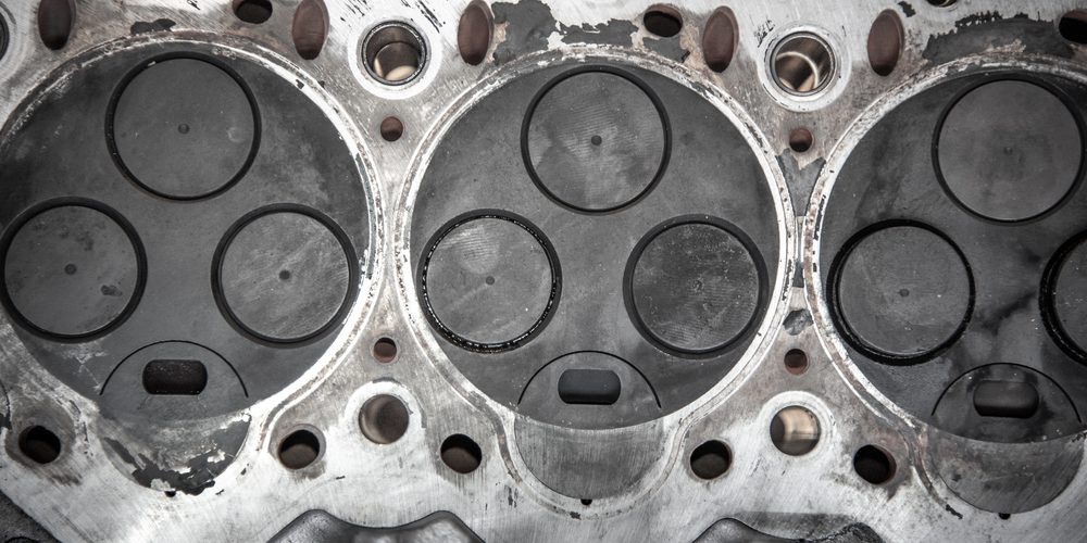 Head removed from the engine with visible three valves
