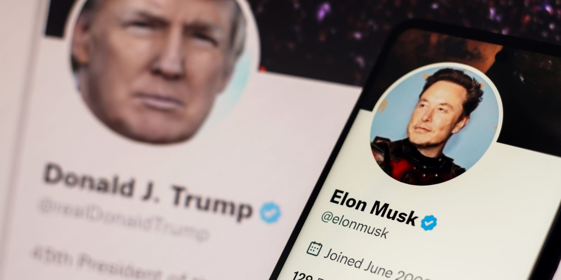 In this photo illustration, the Donald Trump Twitter account displayed on a laptop screen and Elon Musk Twitter account displayed on a smartphone screen — Photo by rafapress