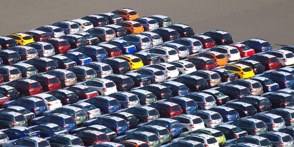 New Japanese car waitng for import at Kawasaki sea port , Japan (image courtesy Deposit Photos)