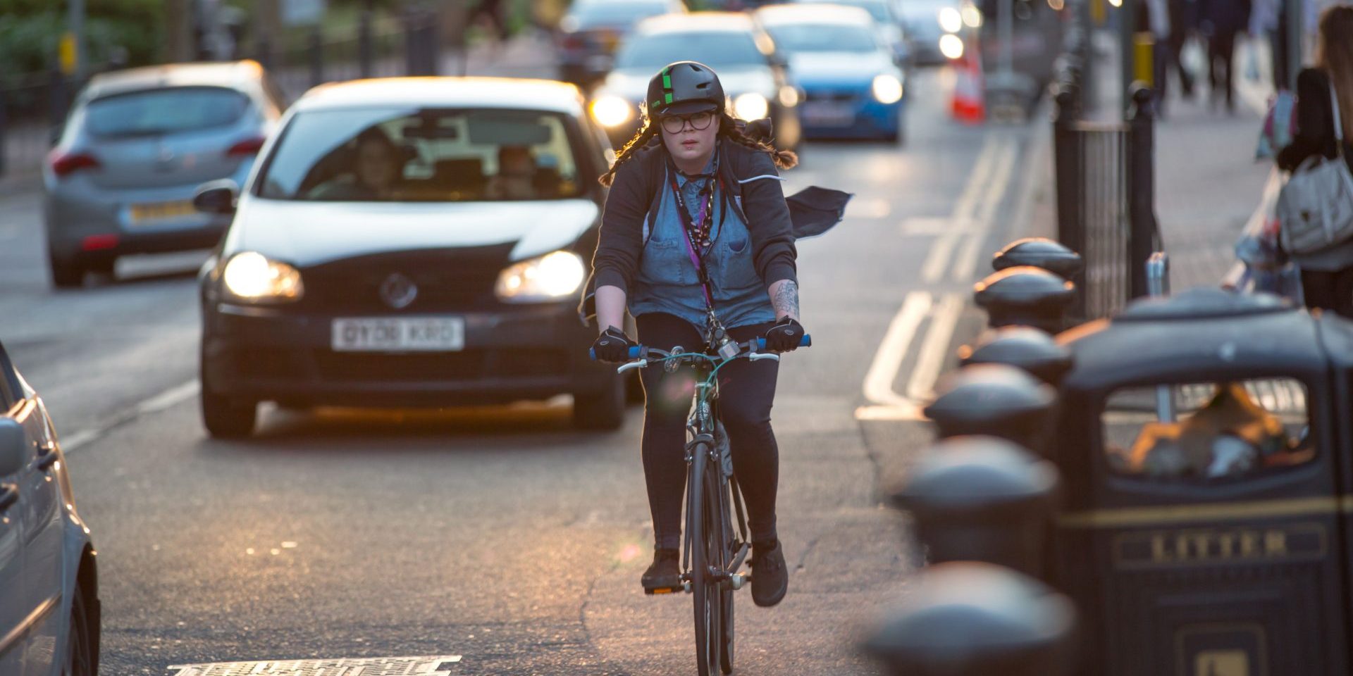 LONDON, UK - 7 SEPTEMBER, 2015: Londoners commuting from work by bike. Road view with cars and bikers