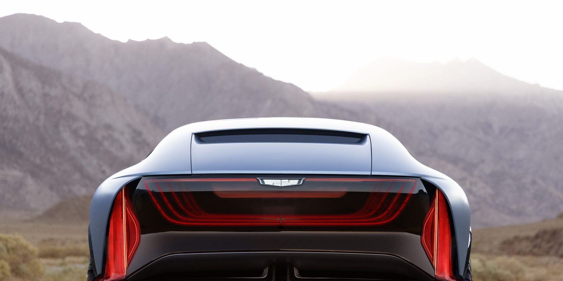 Head on view of the rear of the Cadillac Elevated Velocity concept in Vapor Blue with the desert in the background.