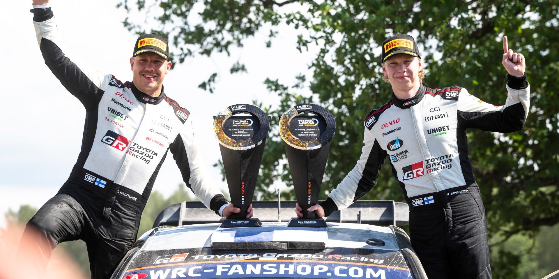 Kalle Rovanpera (FIN) and Jonne Halttunen (FIN) of team Toyota Gazoo Racing  celebrate on the podium in first place after winning the World Rally Championship in Liepaja, Latvia on 21.07.2024 // Jaanus Ree / Red Bull Content Pool // SI202407210328 // Usage for editorial use only //