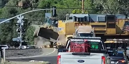 Watch Train Toss Tractor Like A Toy In Semi-Truck Collision